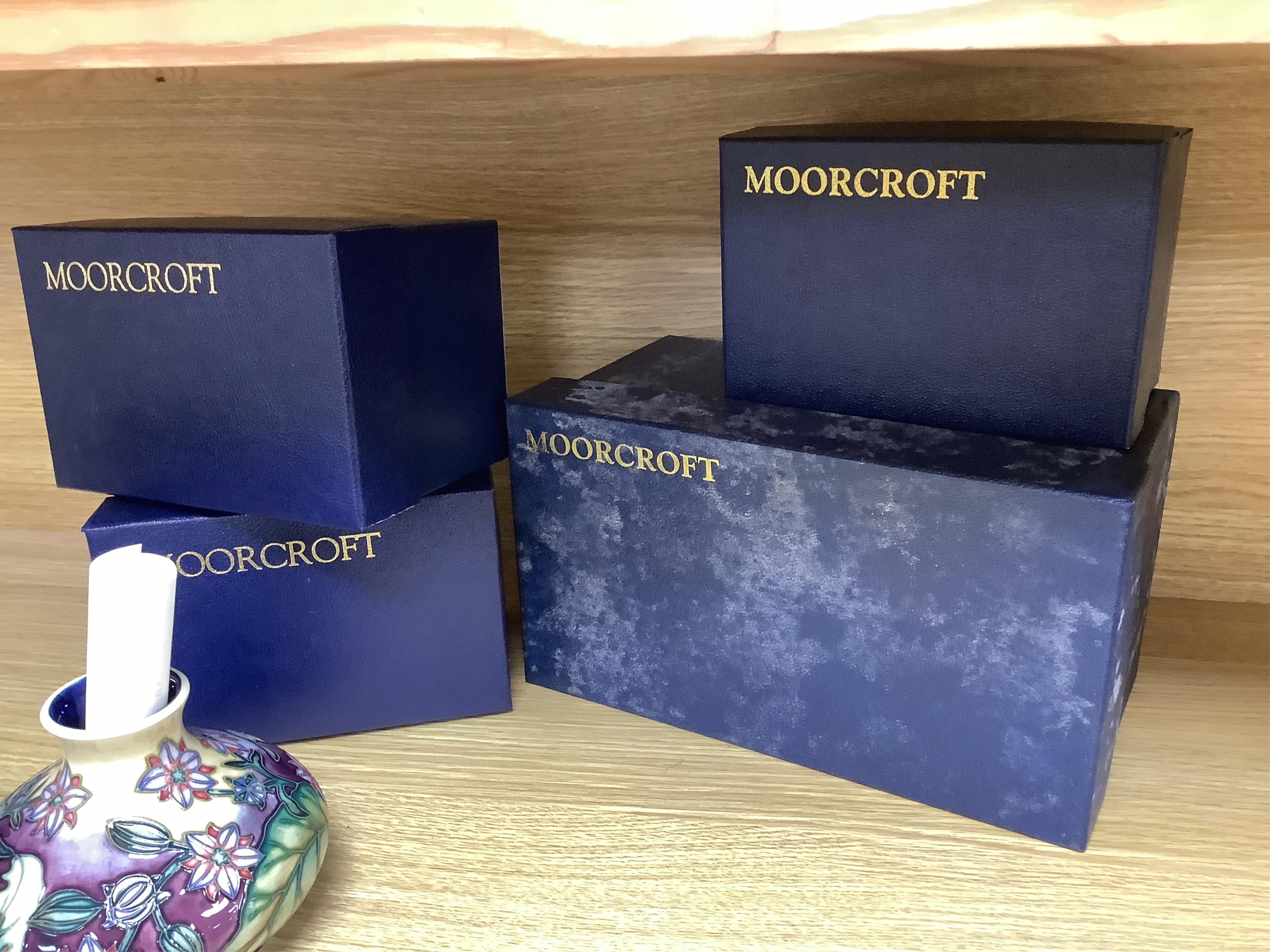 Four Moorcroft vases: Favrile Jar, Kerry vase, Cleopatra vase and a Borage vase. All boxed, tallest 17cm